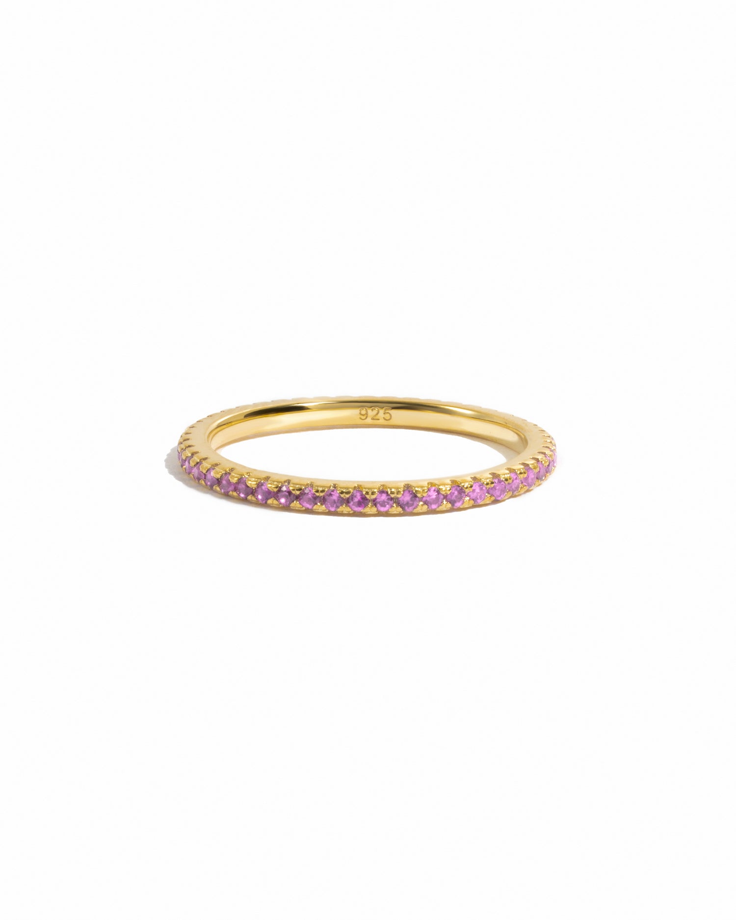 gold rose October birthstone eternity ring white background