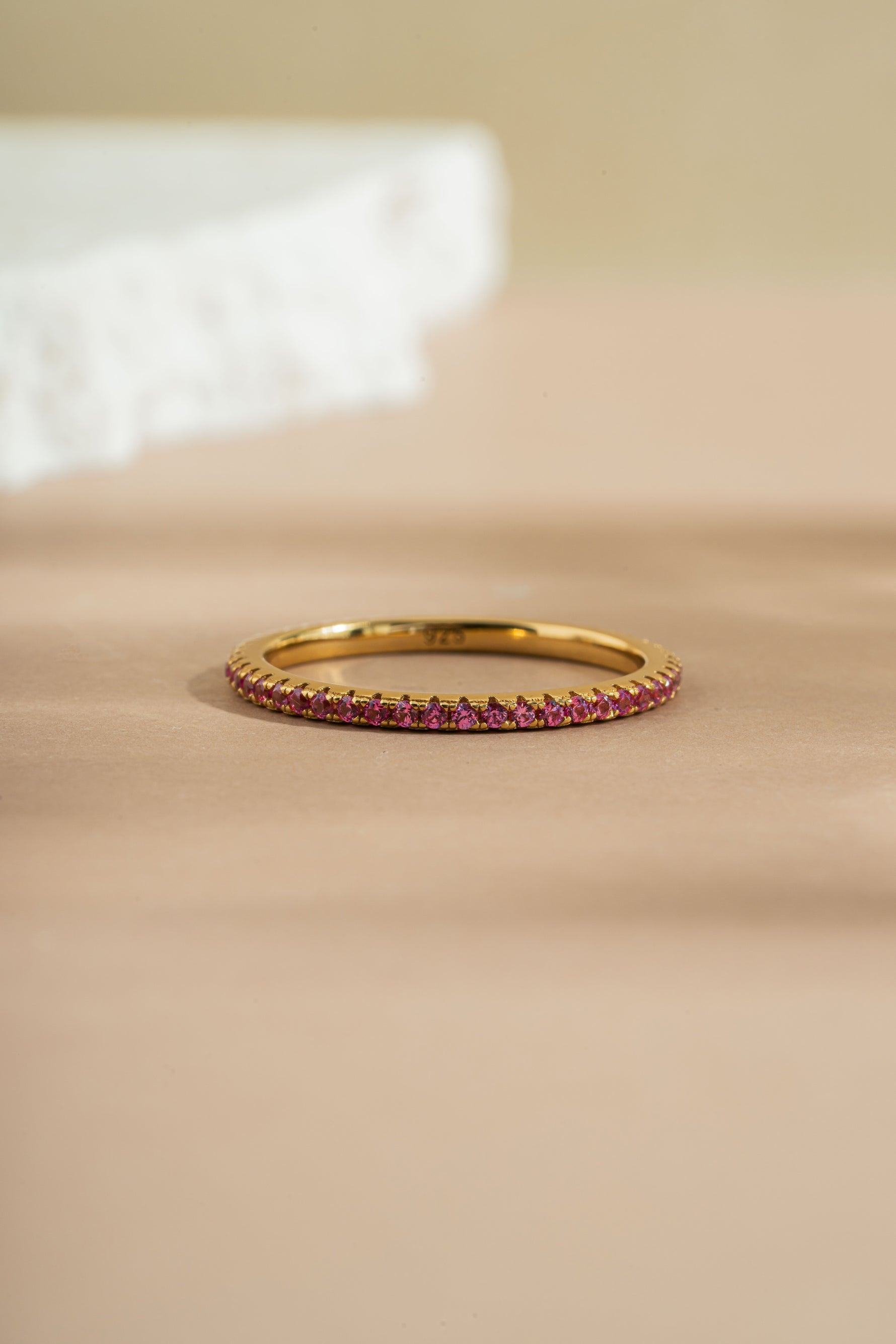 gold rose October birthstone eternity ring front view