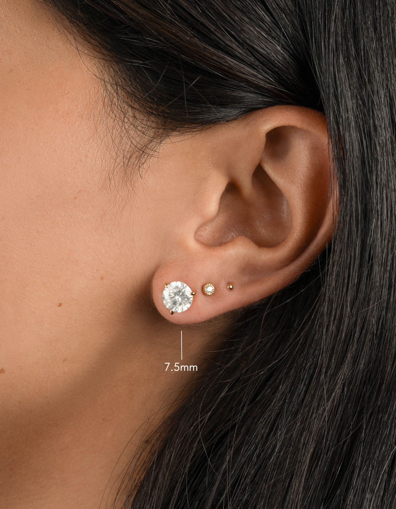 Gold 7.5mm round solitaire diamond stud earrings by Sami Jewels, featuring classic and elegant jewelry design.