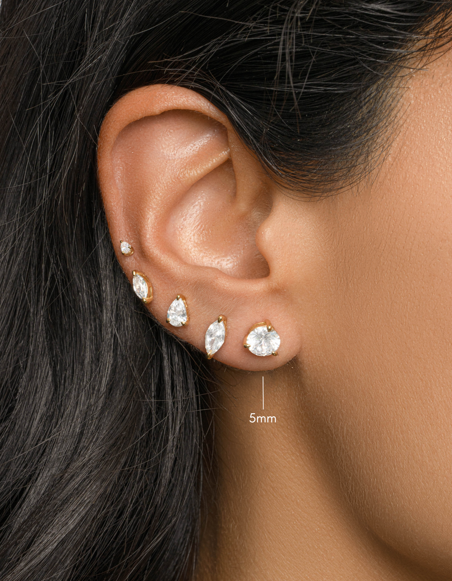 gold round solitaire stud earring stack on womens ear