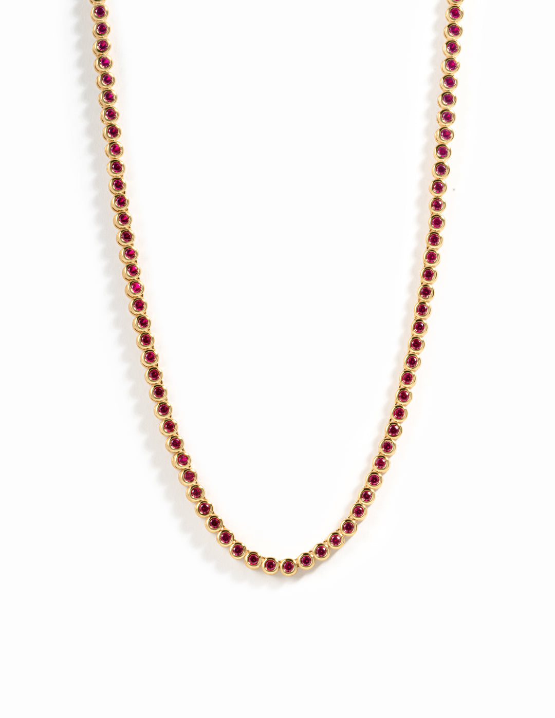 Gold Ruby Bezel Tennis Necklace by Sami Jewels featuring a row of vibrant rubies set in a sleek gold bezel design.