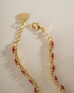Gold Ruby Tennis Bracelet by Sami Jewels featuring a box clasp, showcasing vibrant rubies and elegant design.