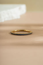 gold sapphire birthstone eternity ring front view