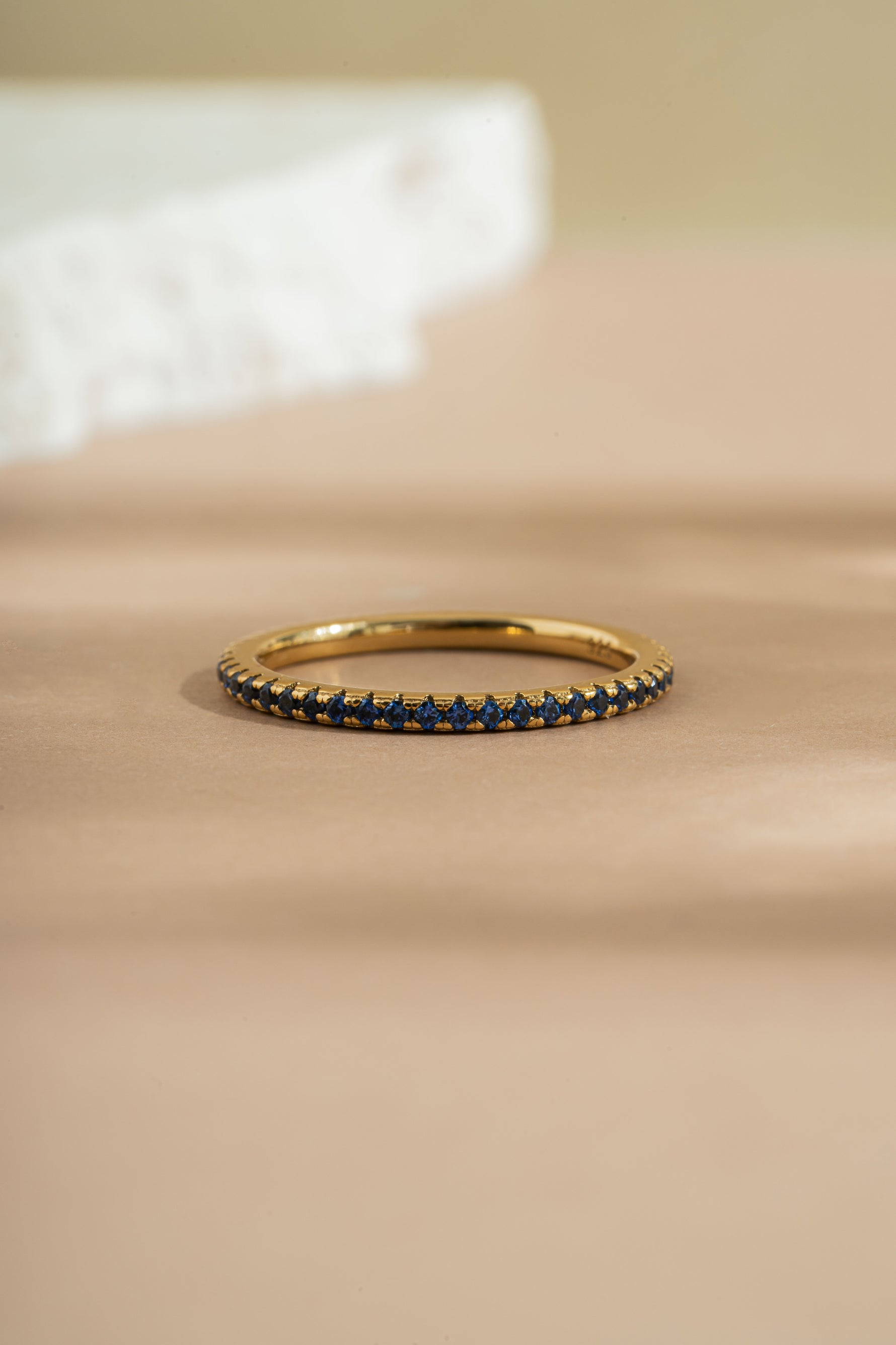 gold sapphire birthstone eternity ring front view
