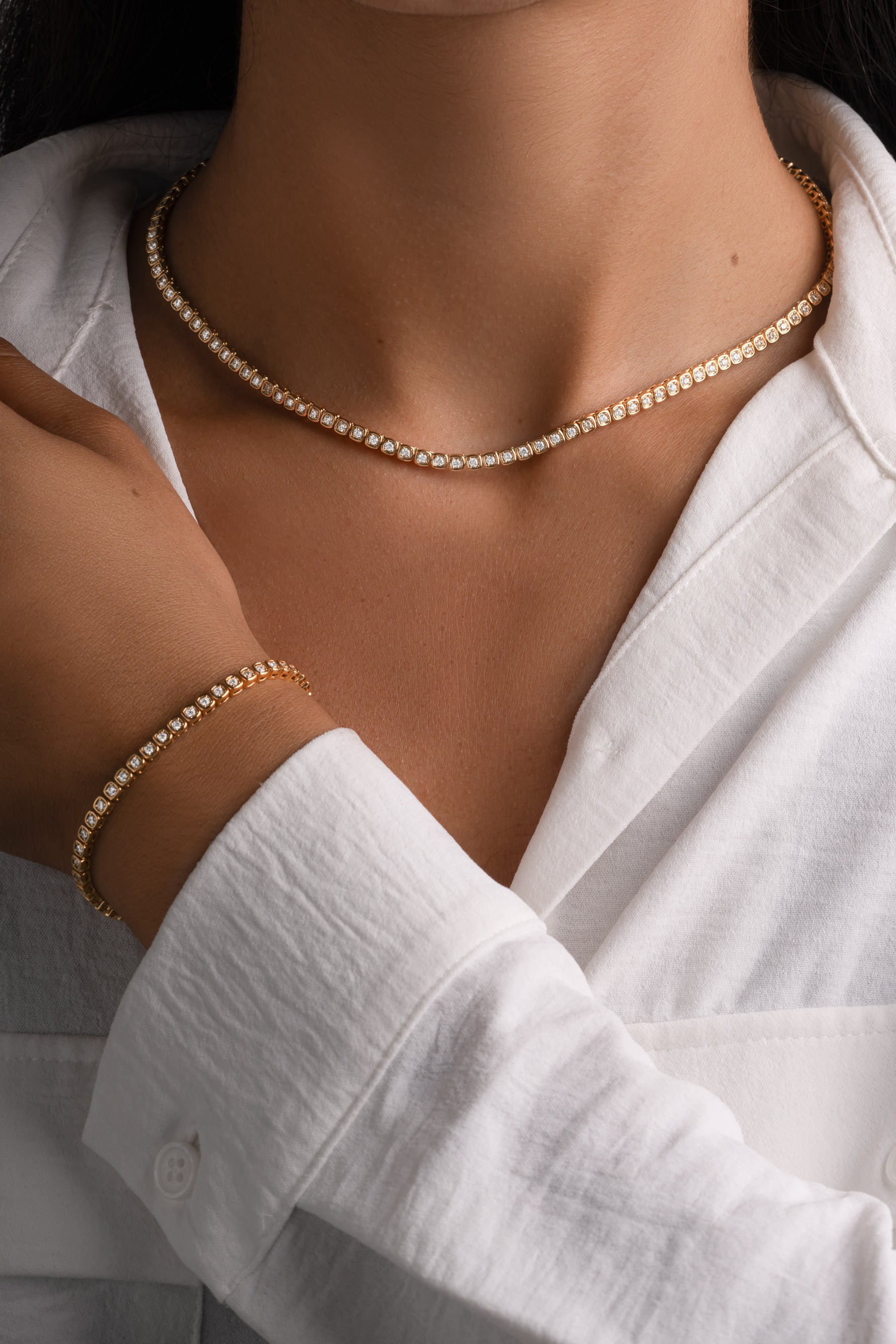 Sami Jewels Chloe Tennis Bundle with gold square-bezel tennis bracelet and matching square-bezel tennis necklace set.