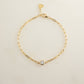 Gold stackable bracelet for her, on white marble background