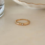 14k Gold Diamond Starburst Ring on marble background