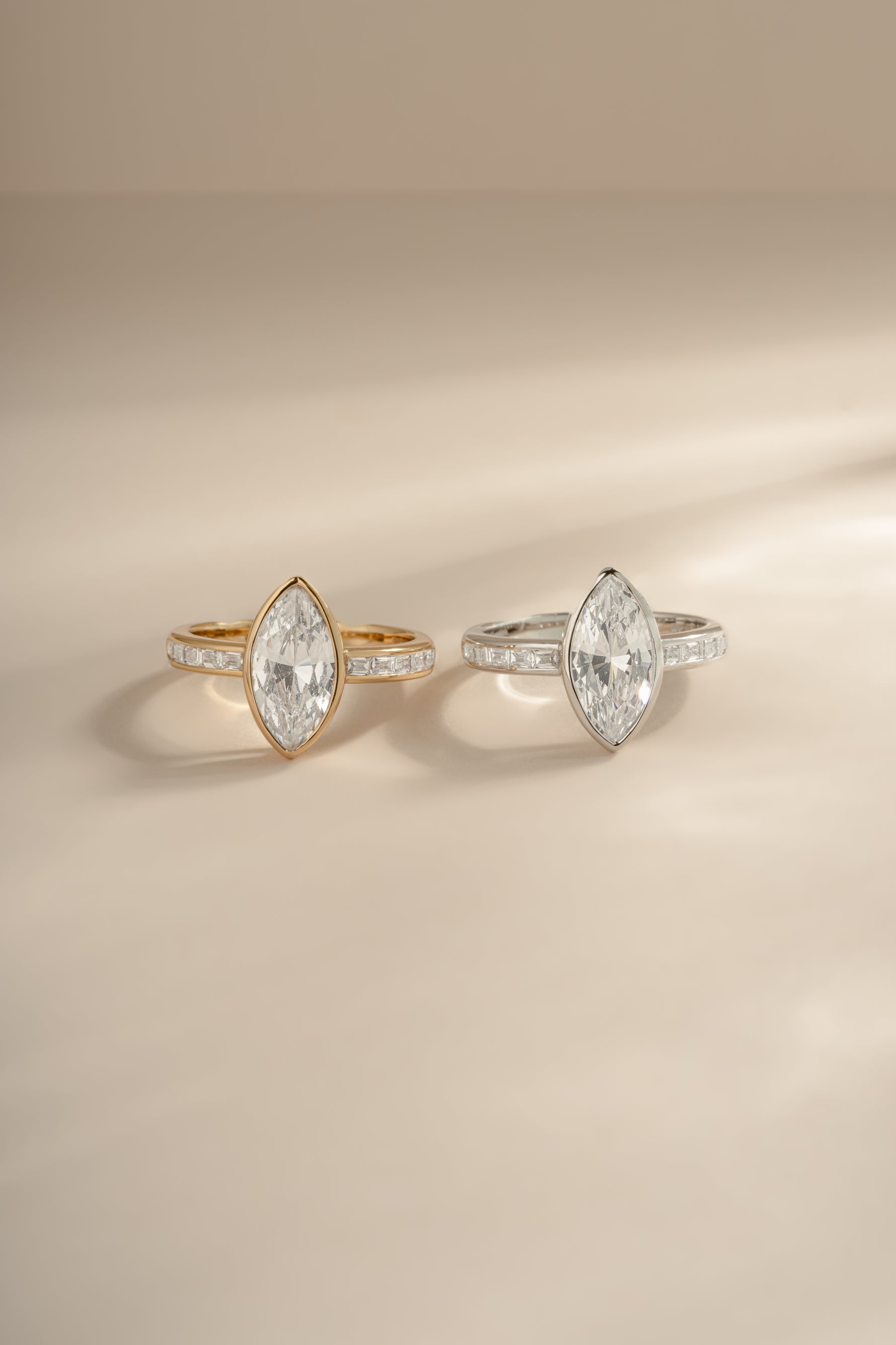 Sterling silver and gold marquise ring with baguette band by Sami Jewels, showcasing elegant geometric design and sparkling gemstones.