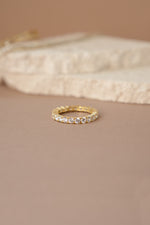 gold studded eternity ring  neutral background