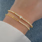 gold heart tennis bracelet paired with a half tennis and half paperclip braclet