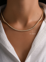 Gold 18-inch Square Tennis Necklace by Sami Jewels, featuring bezel-set cubic zirconia, worn on a model.