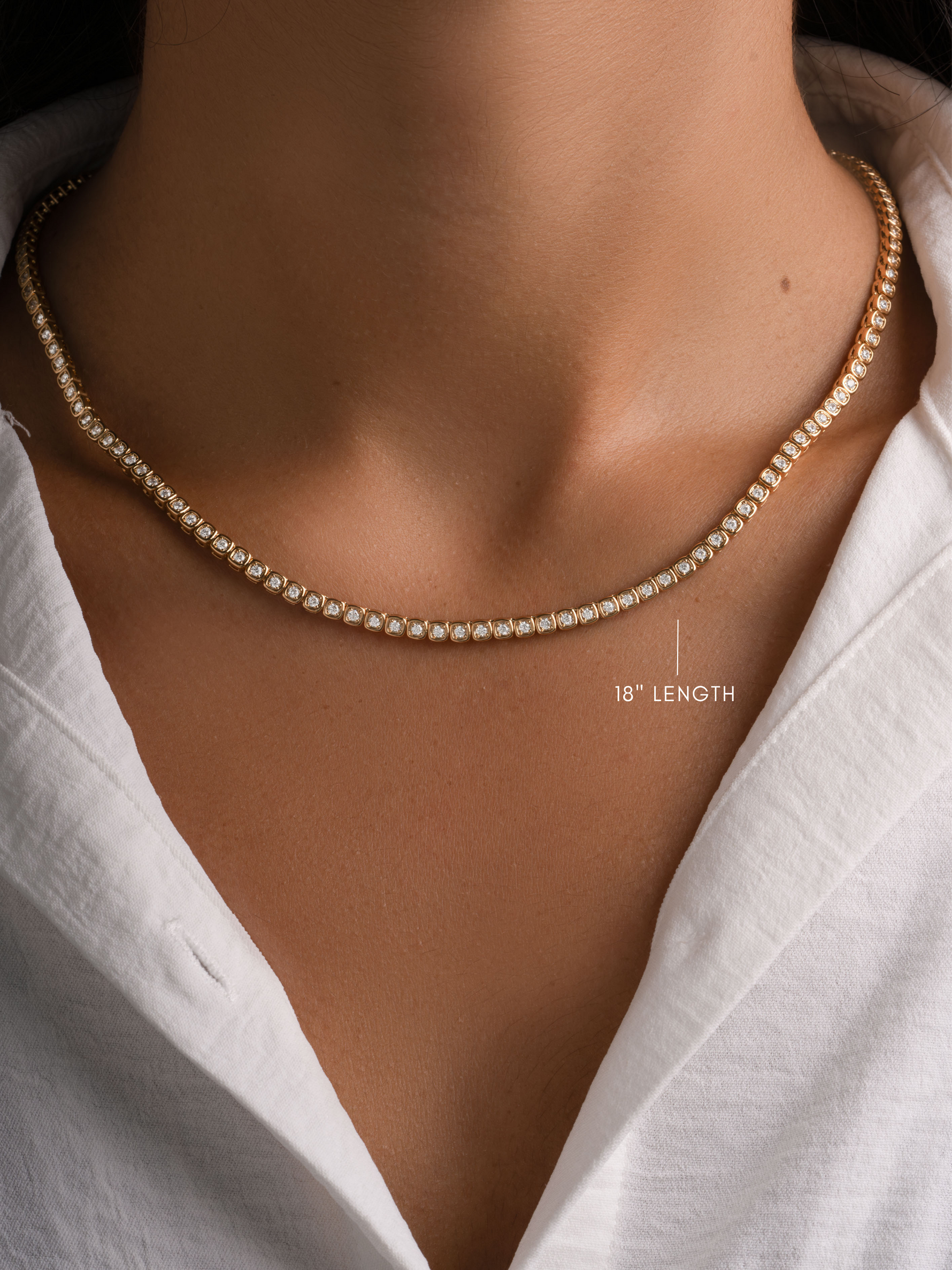 Gold 18-inch Square Tennis Necklace by Sami Jewels, featuring bezel-set cubic zirconia, worn on a model.