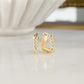 Chunky triangle hoop earrings in 14k gold with a textured pattern. 