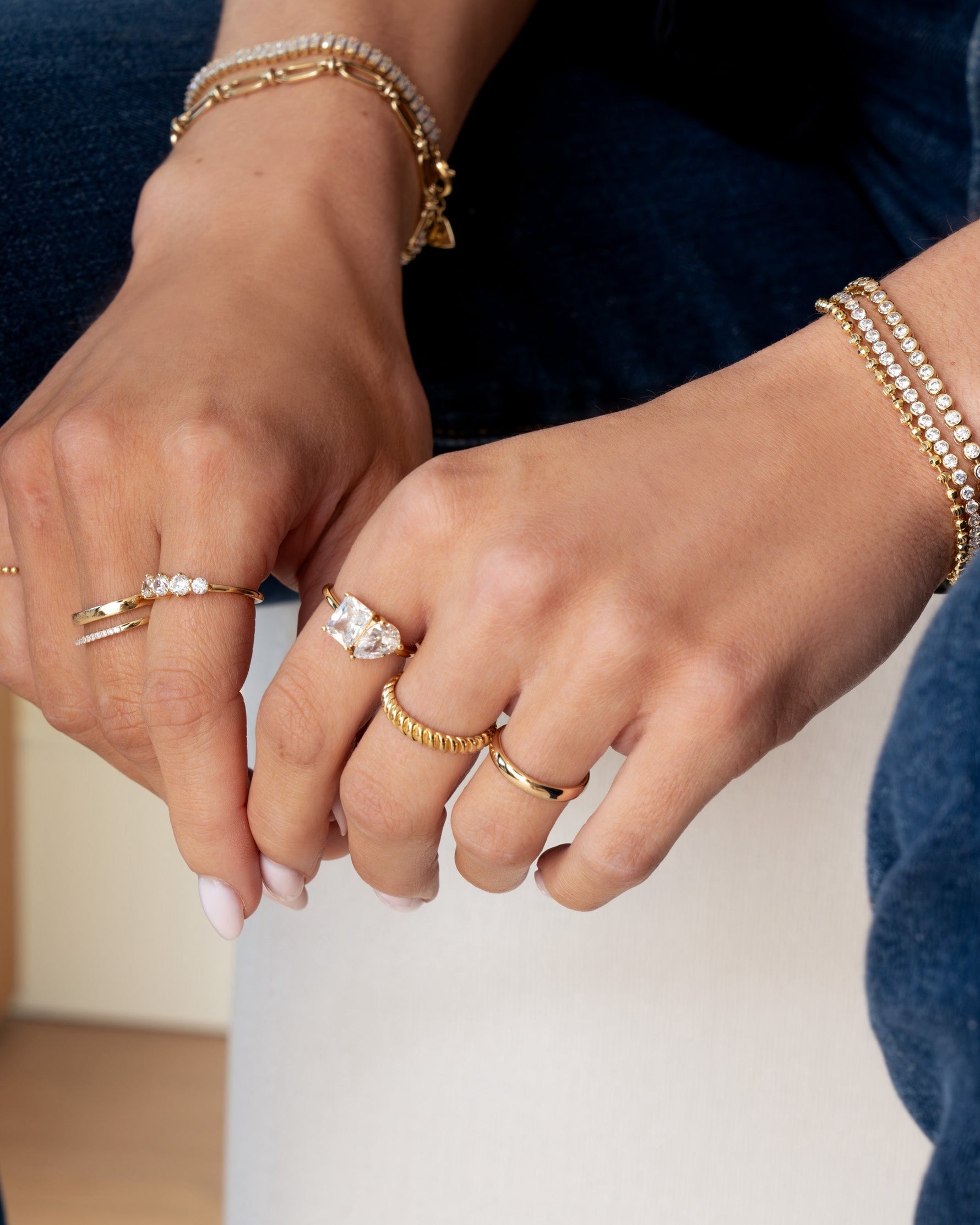 gold toi et moi diamond ring stack closeup on models hand