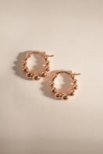 Rose gold Graduated Beaded Hoop Earrings by Sami Jewels, featuring a stylish layered beaded design on classic hoop earrings.