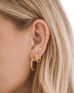 Gold stainless steel SS Half Textured Hoops earrings by Sami Jewels, featuring a close-up of the half-textured design on huggie-style earrings.