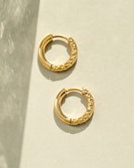 Gold stainless steel SS half textured huggie hoop earrings by Sami Jewels, showcasing a stylish and waterproof jewelry design.