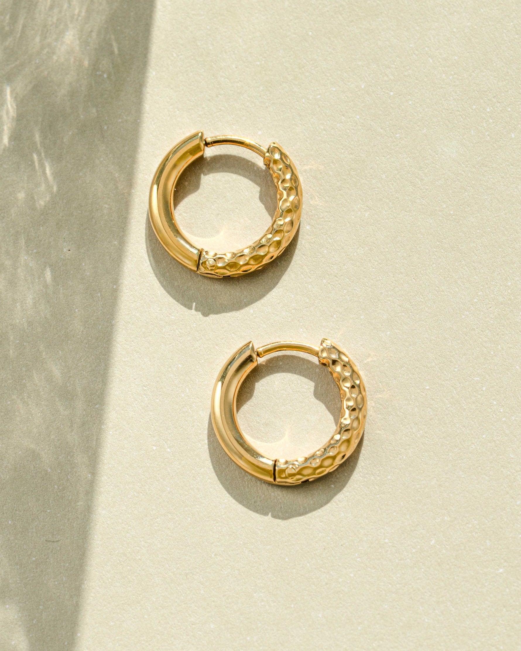 Gold stainless steel SS half textured huggie hoop earrings by Sami Jewels, showcasing a stylish and waterproof jewelry design.