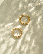 Gold stainless steel SS half textured hoop earrings from Sami Jewels, featuring a huggie design and waterproof finish.