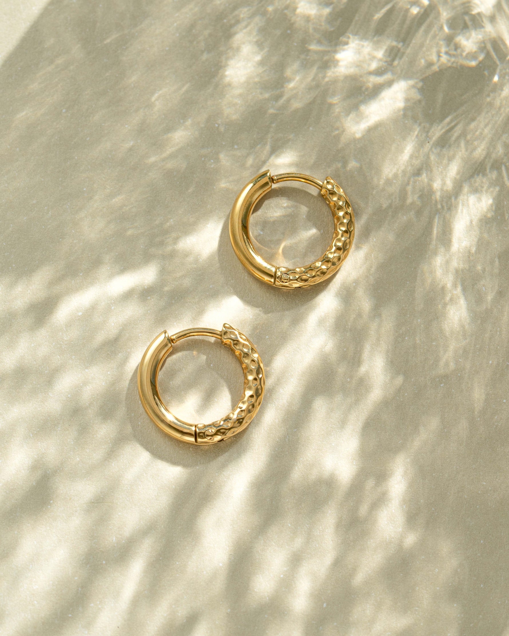 Gold stainless steel SS half textured hoop earrings from Sami Jewels, featuring a huggie design and waterproof finish.