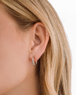 Silver stainless steel SS half textured huggie hoop earrings by Sami Jewels with a sleek, modern design and waterproof finish.