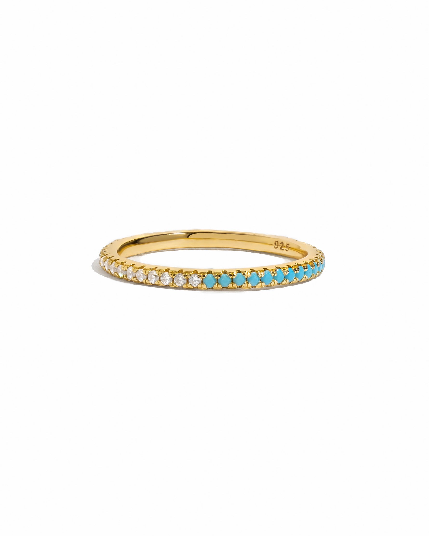 Dainty Sami Jewels gold eternity ring with turquoise and diamond accents, showcasing intricate design on a white background.