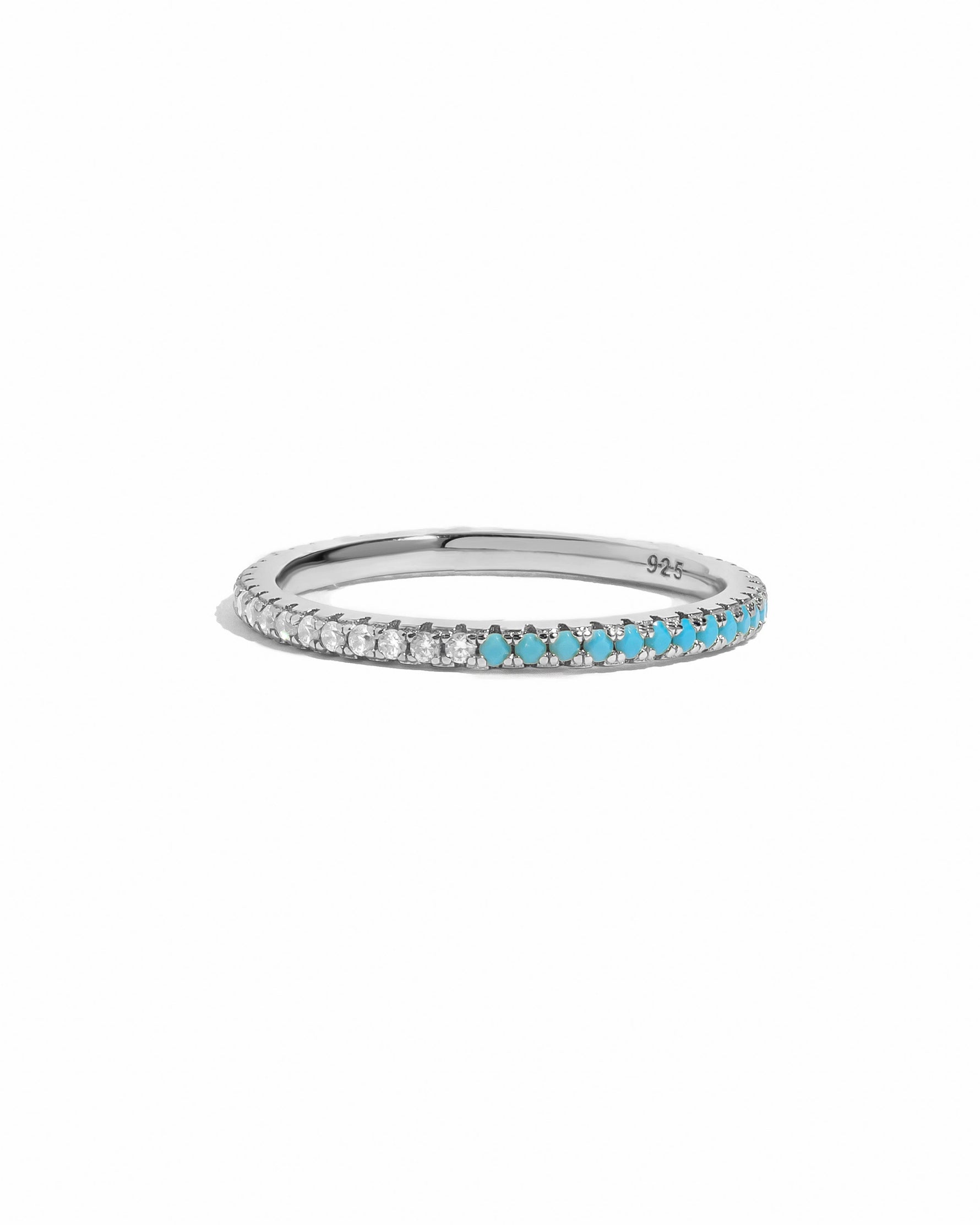 Sami Jewels turquoise and diamond eternity ring featuring sterling silver band with alternating turquoise and diamond accents.
