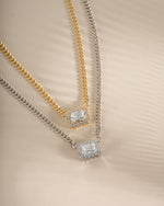 Sterling silver and gold Halo Emerald Cut Necklace on a Cuban chain by Sami Jewels, showcasing a sparkling emerald-shaped pendant.