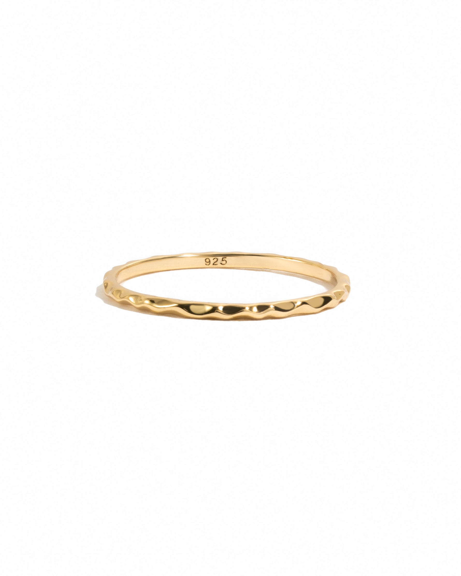 Gold hammered stacking ring from Sami Jewels displayed on a white background, showcasing its textured, layered design.