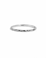 Sterling silver hammered stacking ring from Sami Jewels, featuring a textured, layered design on a white background.