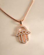 Rose gold Hamsa necklace from Sami Jewels featuring a detailed Hamsa pendant on a delicate chain.