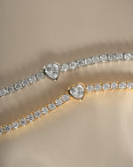 Gold and silver heart charm tennis bracelet by Sami Jewels featuring delicate, sparkling links and a charming heart pendant.