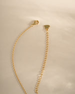Gold heart necklace from Sami Jewels with lobster clasp closure, featuring a delicate and elegant design.