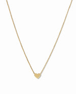 Gold heart necklace from Sami Jewels with a delicate chain, displayed against a white background.