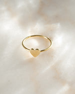 Gold Valentina Heart Ring by Sami Jewels, angled view showcasing the heart-shaped design and elegant band.