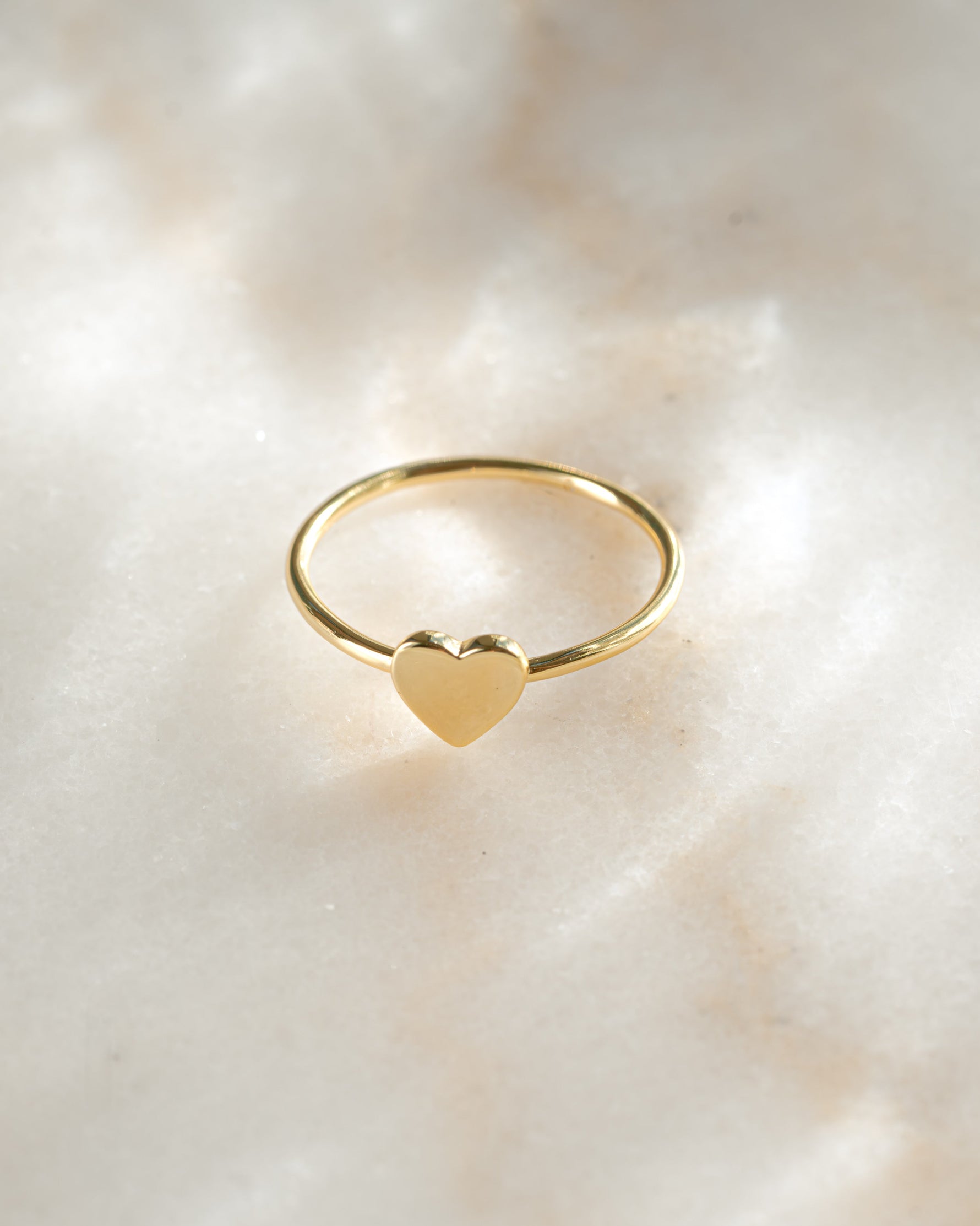 Gold Valentina Heart Ring by Sami Jewels, angled view showcasing the heart-shaped design and elegant band.