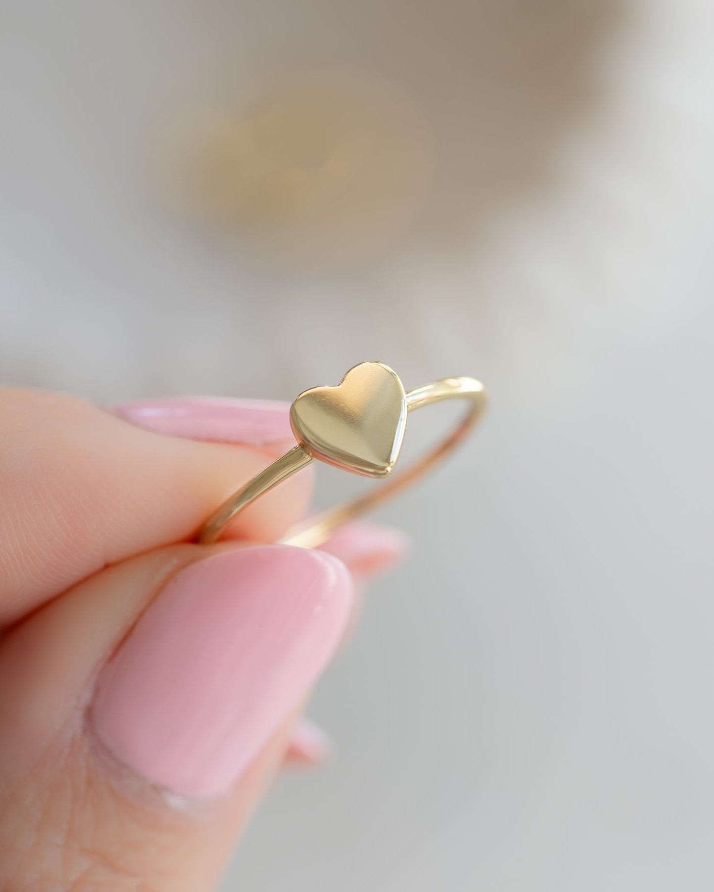 Close-up of Sami Jewels Valentina Heart Ring in gold, featuring a detailed heart-shaped design on a sleek band.