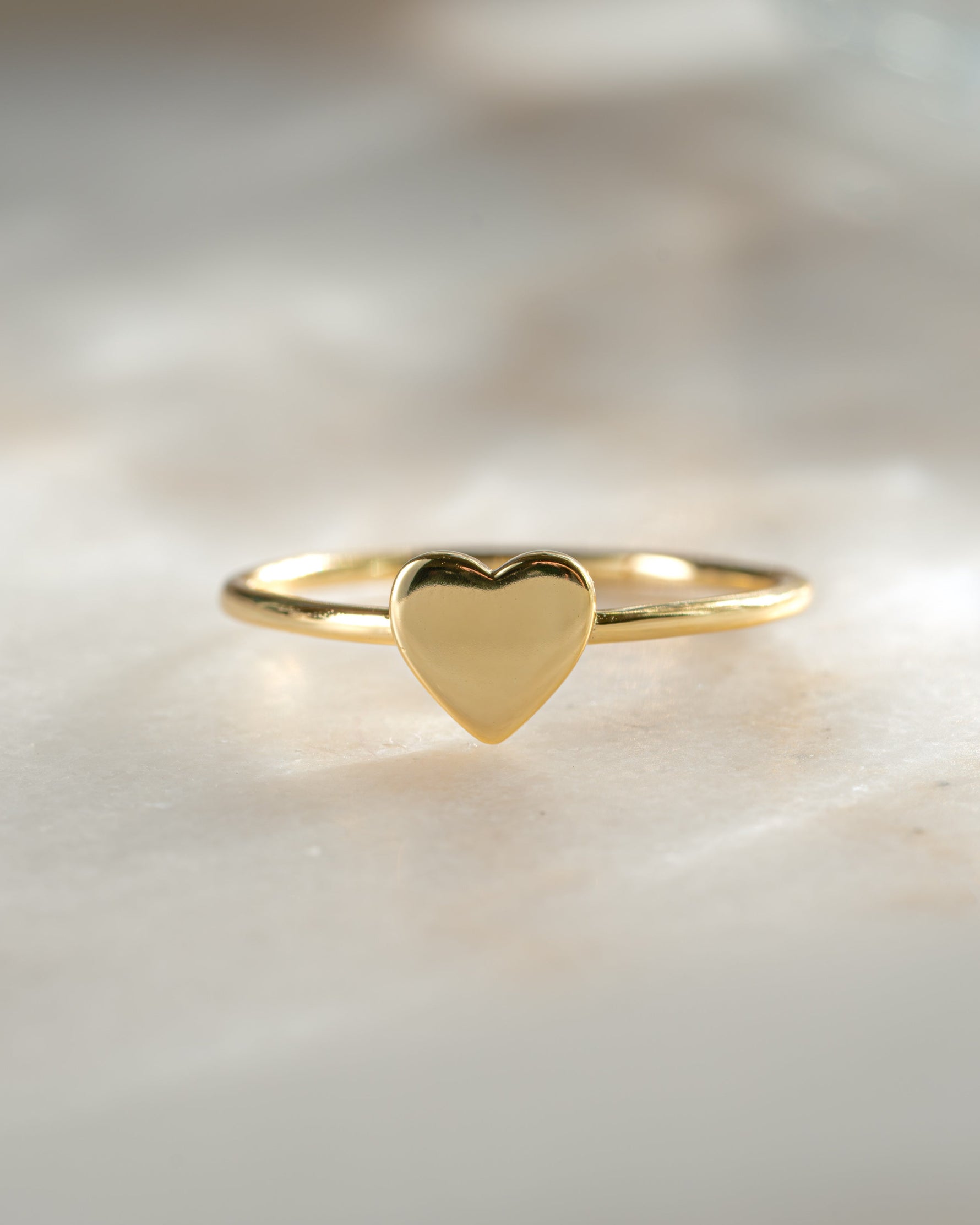 Close-up of Sami Jewels Valentina Heart Ring in gold, showcasing the heart-shaped design and intricate detailing on the ring.