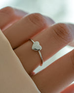 Sterling silver Valentina Heart Ring by Sami Jewels worn on a model's finger, featuring a heart-shaped design and intricate detailing.