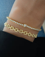 Sami Jewels Heart Charm Tennis Bracelet featuring sparkling heart-shaped charms on a delicate tennis bracelet.