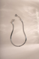 Sterling silver 2mm herringbone bracelet by Sami Jewels featuring a sleek, woven chain design.