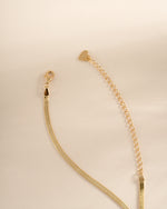Gold 2mm herringbone chain necklace from Sami Jewels, featuring a smooth, flat woven design for elegant everyday wear.