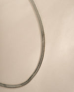 Silver 2mm herringbone chain necklace by Sami Jewels, showcasing a sleek, flat woven design with a polished finish.
