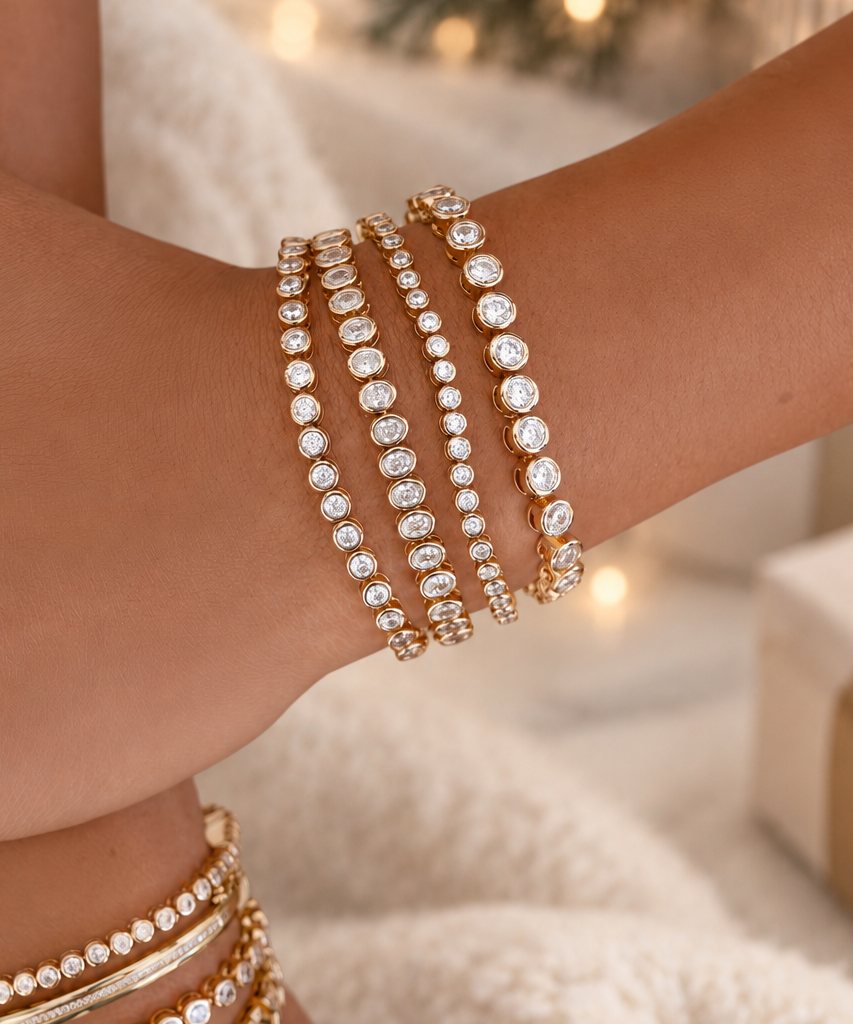Stacked tennis bracelets on a wrist