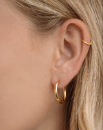 Sami Jewels SS Plain Tube Hoop Earrings in gold stainless steel with hinged design, waterproof and stylish for everyday wear.