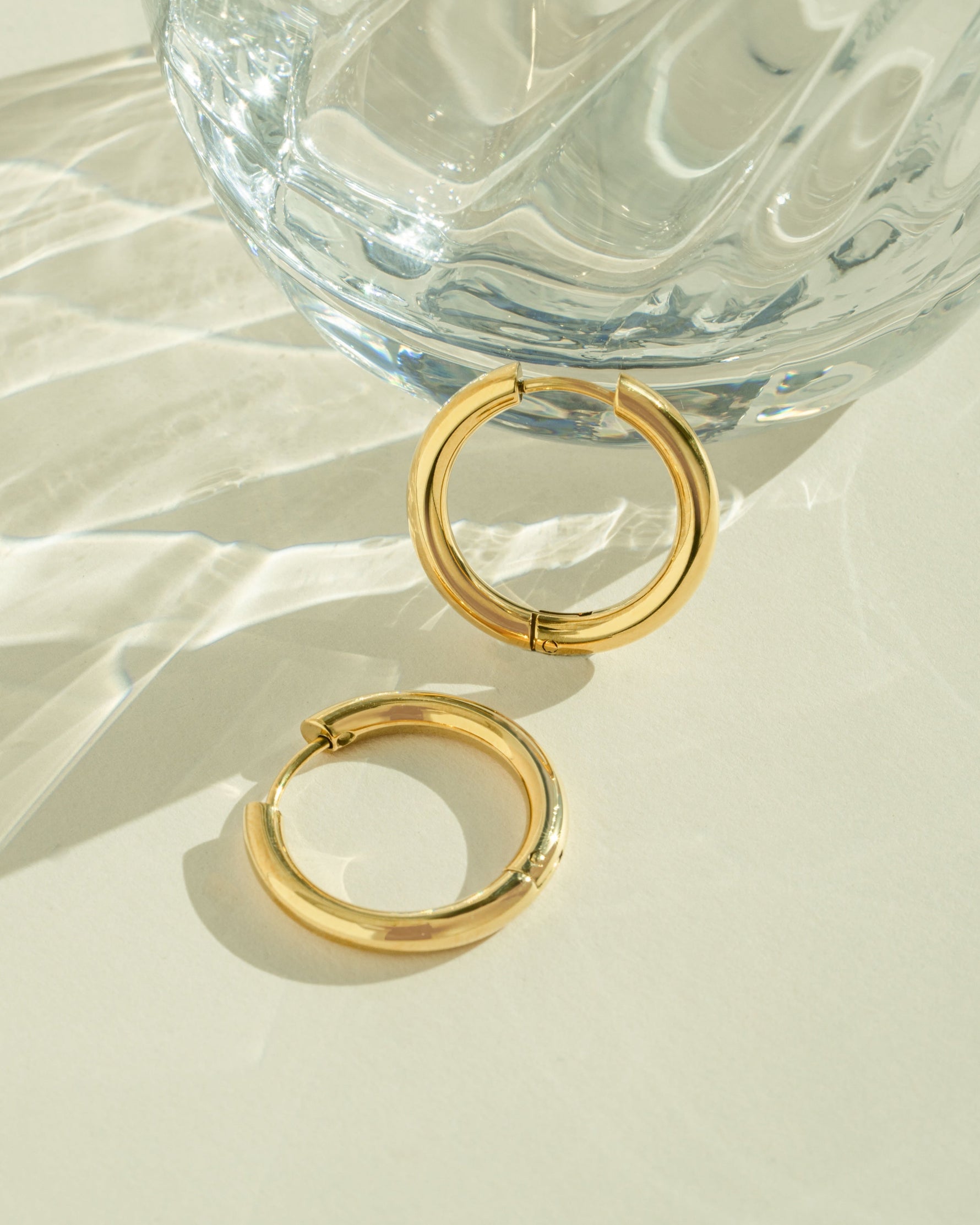 Gold stainless steel SS Plain Tube Hoop Earrings by Sami Jewels, hinged design shown from side view.