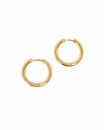 Gold stainless steel hinged tube hoop earrings from Sami Jewels, waterproof and stylish jewelry accessory.