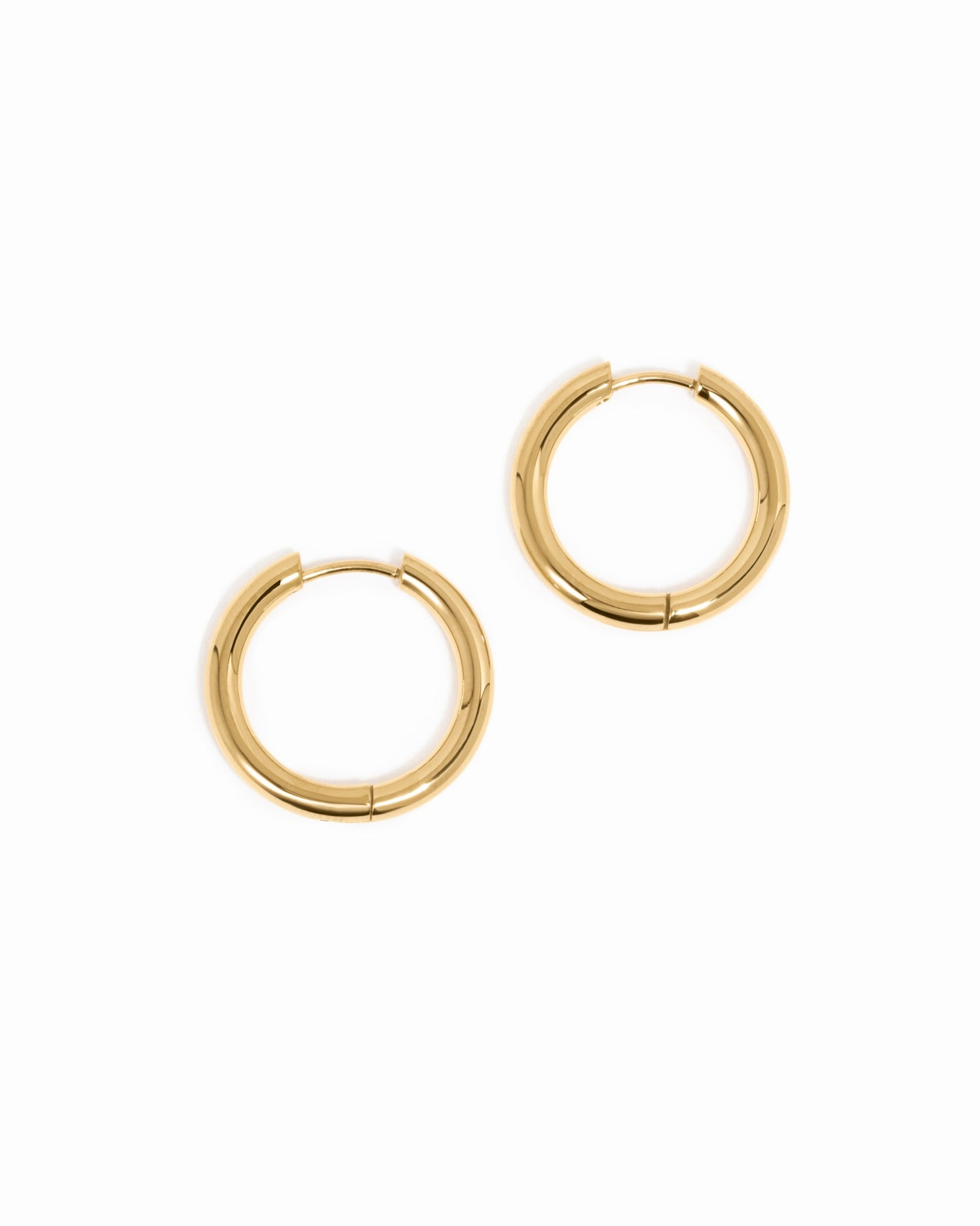 Gold stainless steel hinged tube hoop earrings from Sami Jewels, waterproof and stylish jewelry accessory.