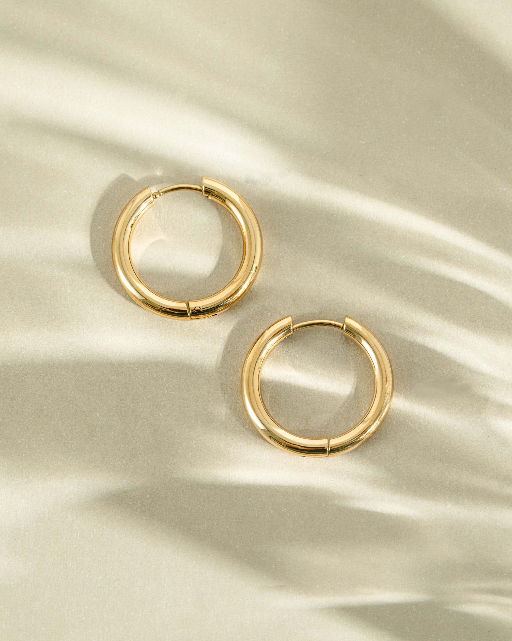 Gold stainless steel SS Plain Tube Hoops earrings with hinged design, waterproof jewelry from Sami Jewels.