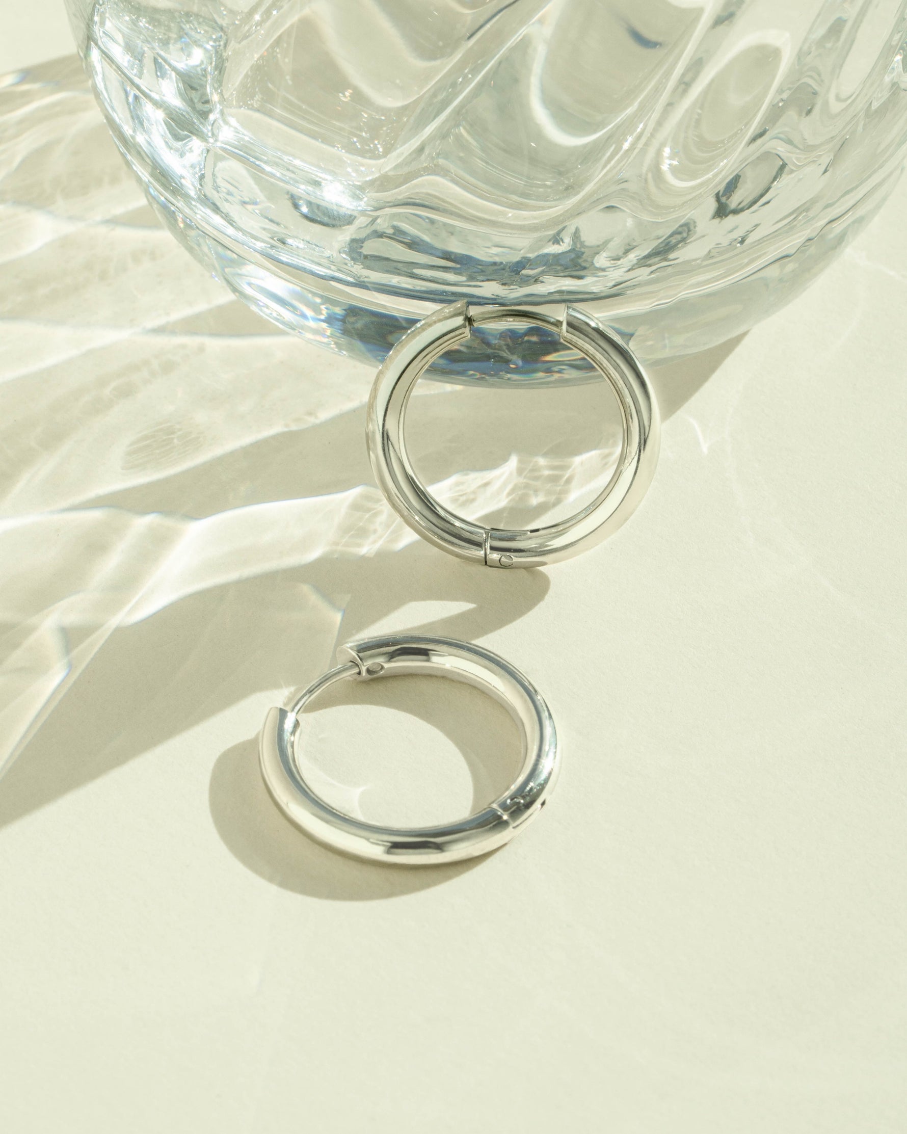 Silver stainless steel SS Plain Tube Hoop Earrings by Sami Jewels, close-up of hinged waterproof hoop earrings